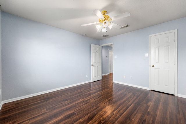 unfurnished room with dark wood-style flooring, baseboards, and ceiling fan