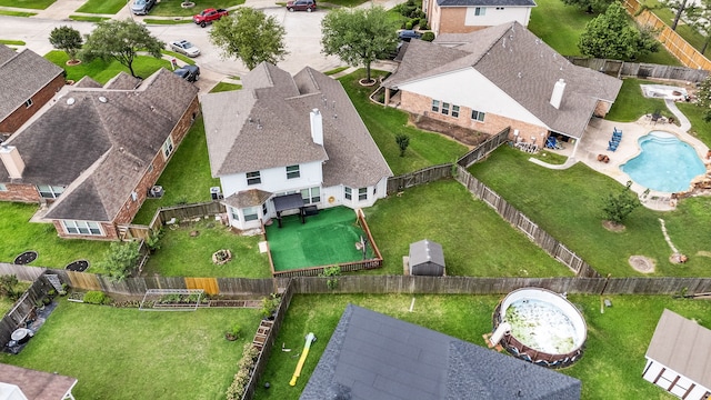 aerial perspective of suburban area with a pool