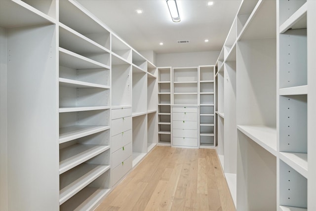 spacious closet featuring light wood-style floors and visible vents