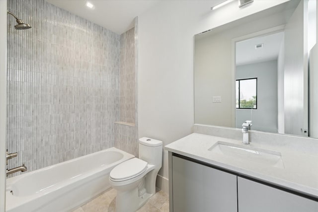 bathroom featuring tile patterned floors, toilet,  shower combination, and vanity
