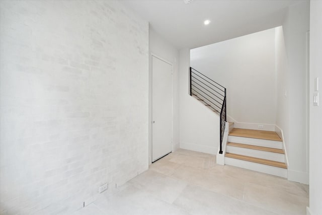staircase with recessed lighting
