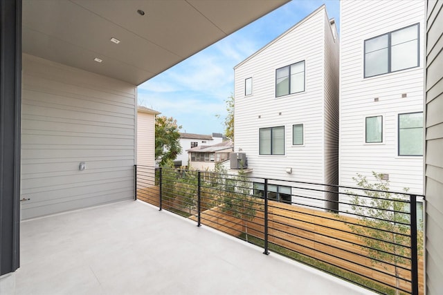 view of patio / terrace featuring cooling unit and a balcony