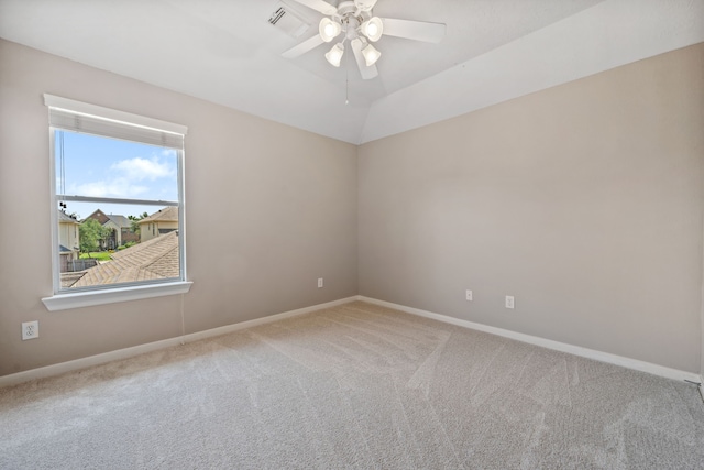 unfurnished room with carpet flooring, a ceiling fan, and baseboards
