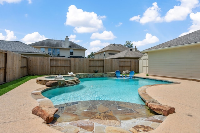 view of swimming pool with a storage shed, a fenced backyard, a patio, and a pool with connected hot tub
