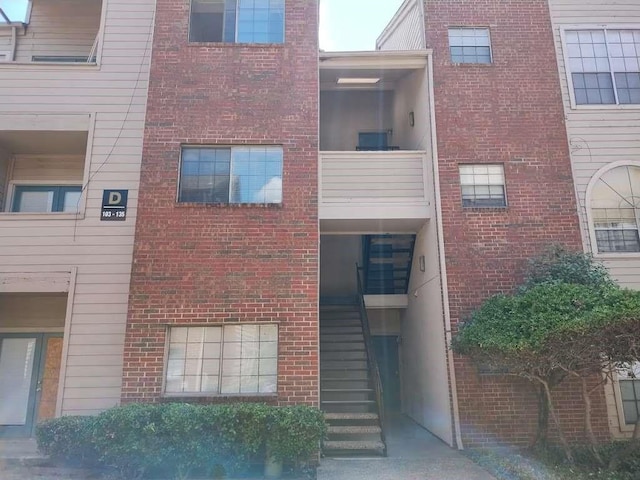 view of property featuring stairway