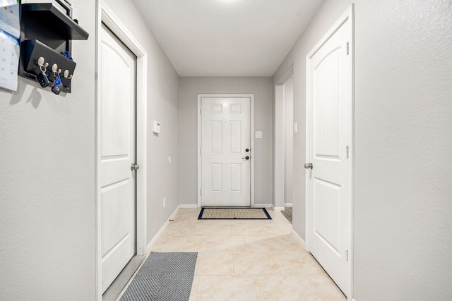 29014 Jacobs River Dr, Katy, TX 77494 - entryway with light tile patterned flooring and baseboards