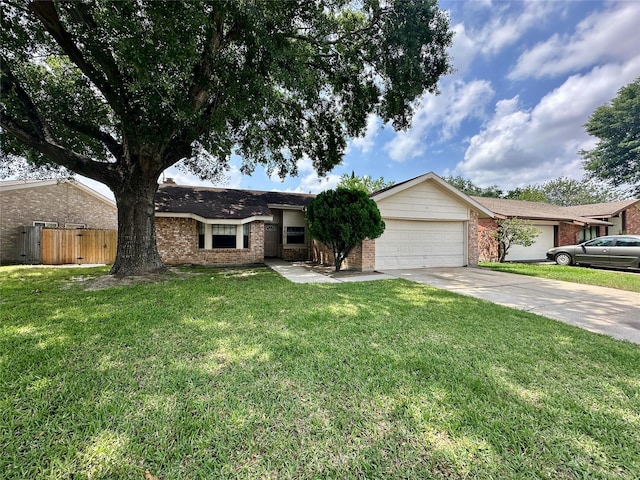 4230 E Terrace Creek Cir, Houston, TX 77014 - ranch-style home with brick siding, fence, a garage, concrete driveway, and a front yard