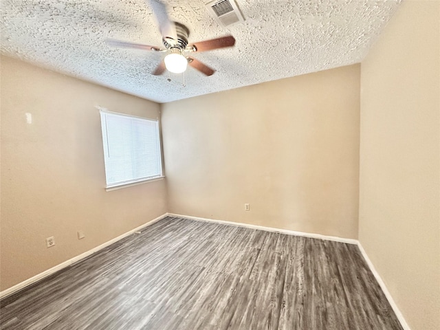 4230 E Terrace Creek Cir, Houston, TX 77014 - spare room featuring wood finished floors, a textured ceiling, visible vents, ceiling fan, and baseboards