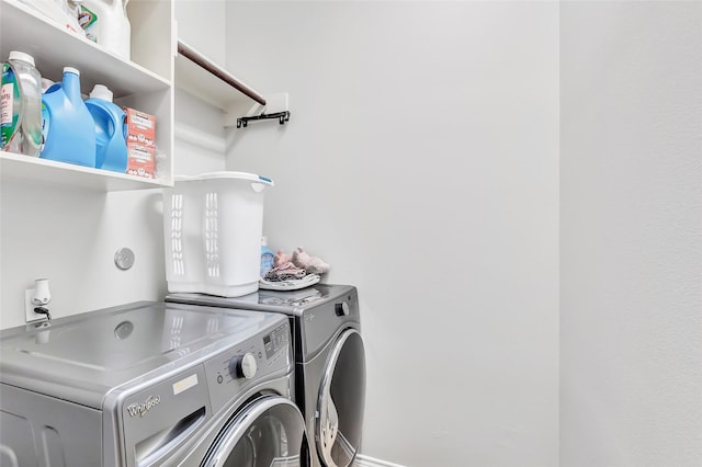 clothes washing area with laundry area and independent washer and dryer