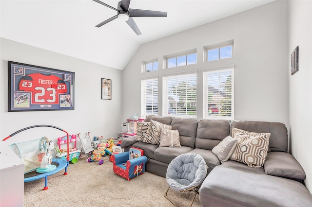 playroom with vaulted ceiling, ceiling fan, and carpet floors