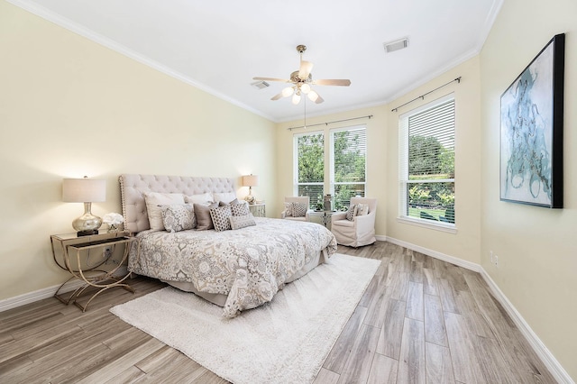 1910 Stormcroft Cir, Katy, TX 77450 - bedroom with wood finished floors, crown molding, baseboards, and ceiling fan