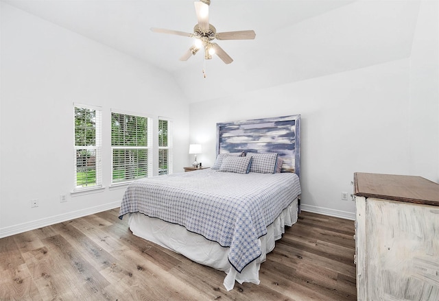 1910 Stormcroft Cir, Katy, TX 77450 - bedroom featuring wood finished floors, vaulted ceiling, baseboards, and ceiling fan