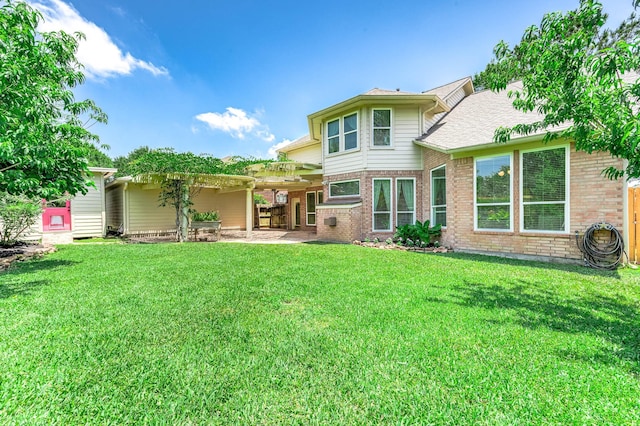 1910 Stormcroft Cir, Katy, TX 77450 - back of house featuring brick siding and a lawn