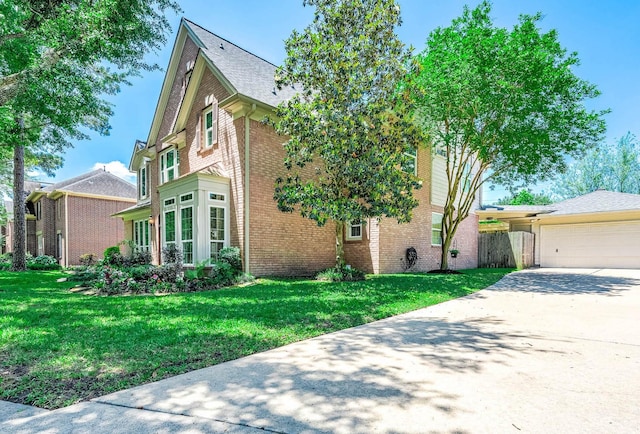 1910 Stormcroft Cir, Katy, TX 77450 - view of front of house with driveway, brick siding, and a garage