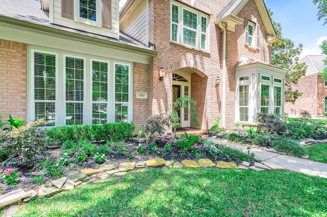 1910 Stormcroft Cir, Katy, TX 77450 - doorway to property featuring brick siding and a yard