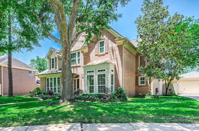 1910 Stormcroft Cir, Katy, TX 77450 - view of front of house with brick siding, a front yard, and an attached garage
