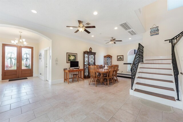 dining space featuring stairway, arched walkways, and recessed lighting
