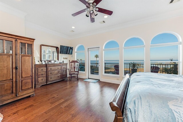 bedroom featuring access to exterior, multiple windows, dark wood-type flooring, visible vents, and ornamental molding
