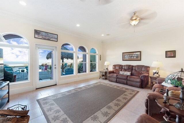 living room with crown molding, light tile patterned floors, a healthy amount of sunlight, and recessed lighting