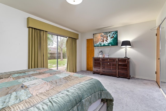 carpeted bedroom featuring access to exterior