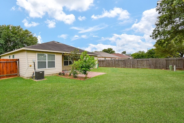 view of yard with a patio and central AC