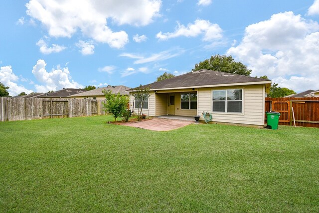 rear view of house with a patio