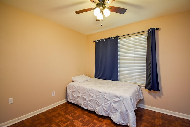 bedroom featuring baseboards and a ceiling fan