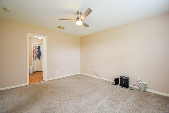unfurnished room with carpet floors, ceiling fan, baseboards, and a smoke detector