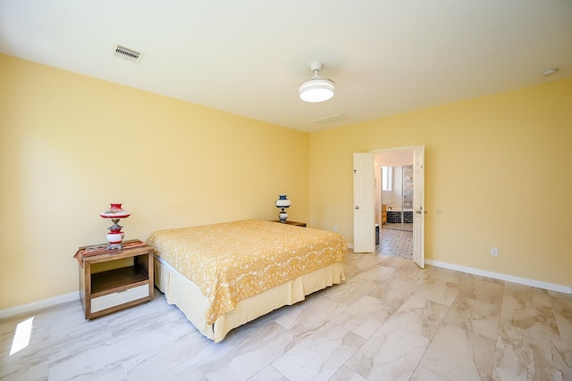 bedroom with baseboards, marble finish floor, and visible vents