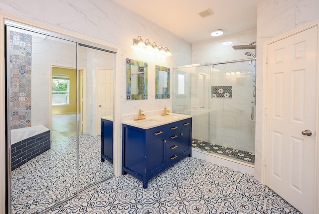 full bathroom with visible vents, tile patterned flooring, and a shower stall