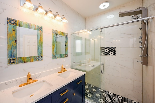 bathroom with a sink, double vanity, and a stall shower