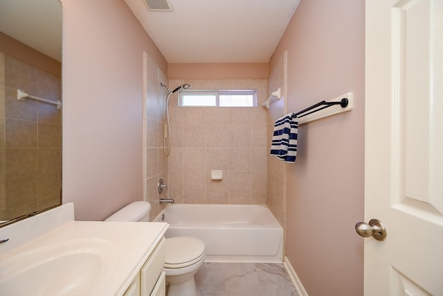 bathroom with toilet, vanity, visible vents, tub / shower combination, and baseboards
