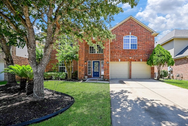 traditional-style home with driveway, brick siding, a front yard, and a garage