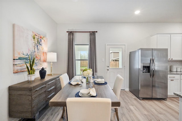 dining room with recessed lighting and light wood-type flooring