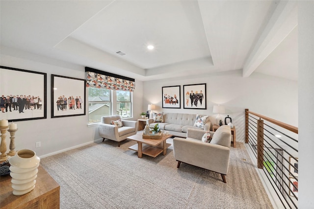 living area with carpet flooring, visible vents, baseboards, a raised ceiling, and recessed lighting