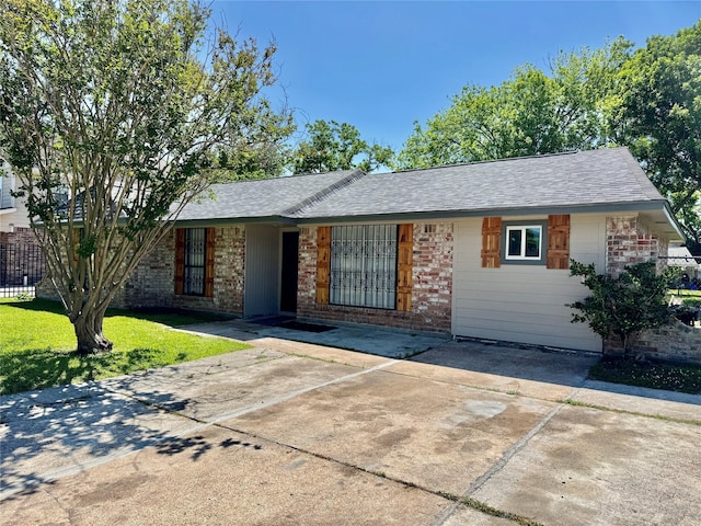 11615 Harrow St, Houston, TX 77093 - ranch-style house with fence, a shingled roof, brick siding, and a front yard