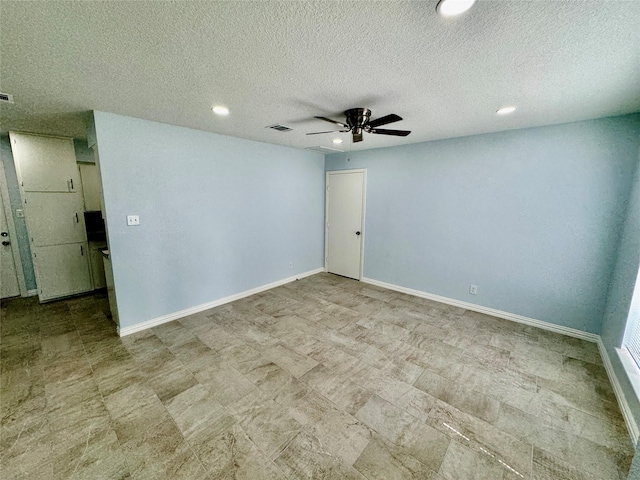 11615 Harrow St, Houston, TX 77093 - spare room with a ceiling fan, recessed lighting, a textured ceiling, baseboards, and visible vents