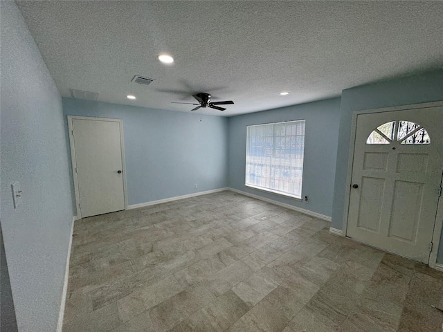 11615 Harrow St, Houston, TX 77093 - foyer entrance featuring a ceiling fan, recessed lighting, a textured ceiling, baseboards, and visible vents