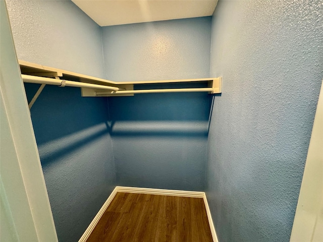 11615 Harrow St, Houston, TX 77093 - walk in closet featuring wood finished floors