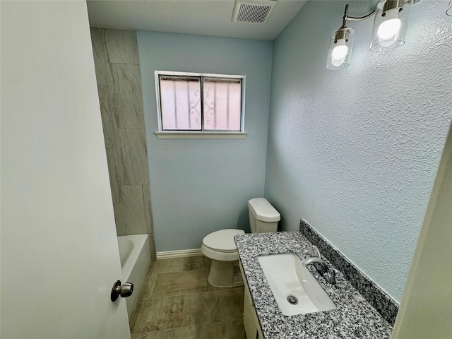 11615 Harrow St, Houston, TX 77093 - bathroom with vanity, toilet, baseboards, and visible vents