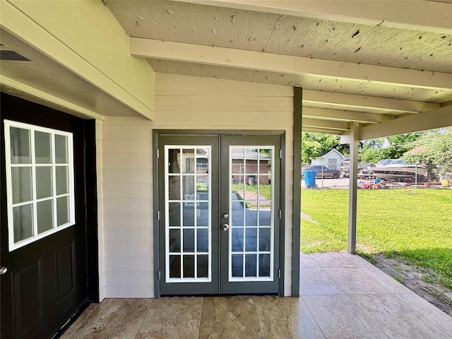 11615 Harrow St, Houston, TX 77093 - property entrance with a yard, a patio, french doors, and visible vents