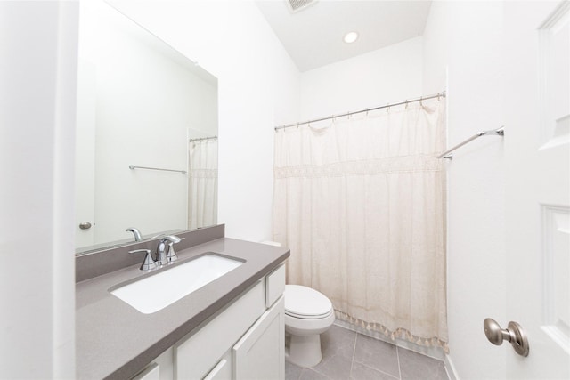 full bathroom with curtained shower, vanity, toilet, and tile patterned floors