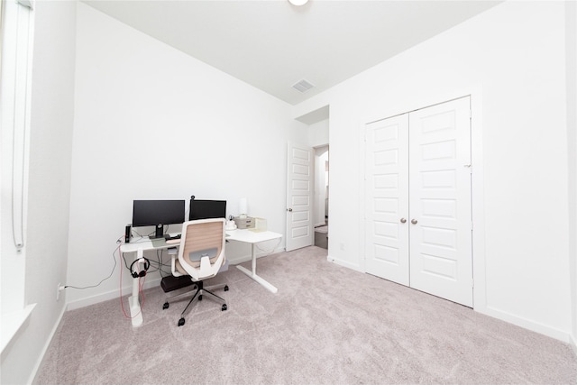 carpeted home office featuring baseboards and visible vents