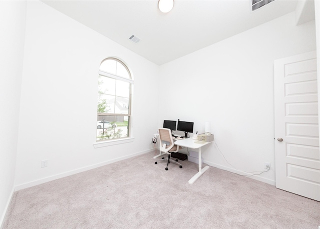 office with carpet floors, baseboards, and visible vents