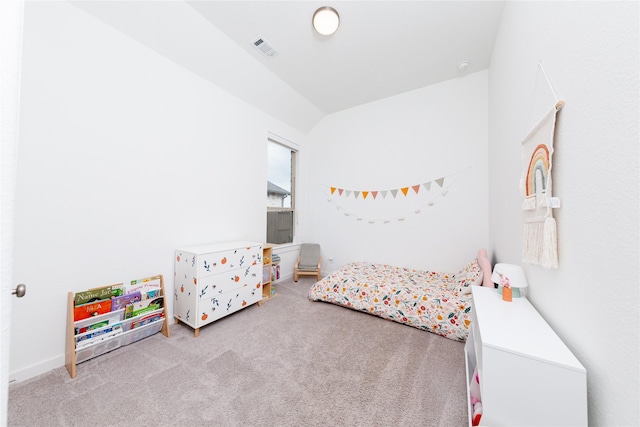 bedroom with lofted ceiling, carpet, and visible vents