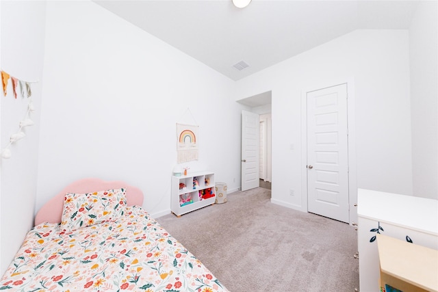carpeted bedroom with vaulted ceiling, visible vents, and baseboards