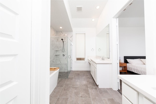 full bathroom with a stall shower, recessed lighting, visible vents, a sink, and two vanities
