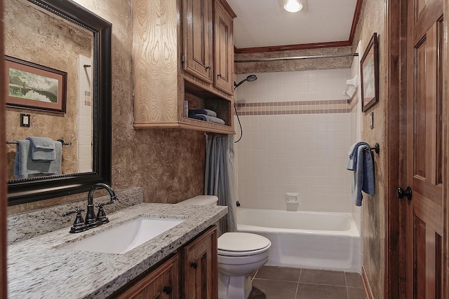 bathroom with toilet, vanity, tile patterned flooring, crown molding, and bathing tub / shower combination