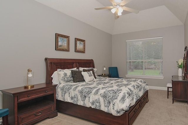 bedroom featuring light colored carpet, baseboards, lofted ceiling, and ceiling fan