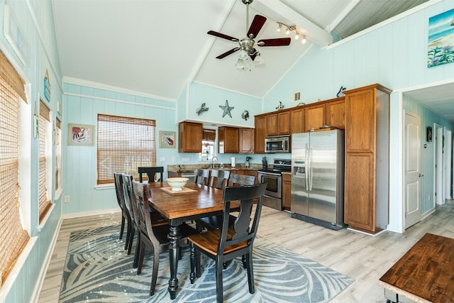 13022 Coronado Dr, Freeport, TX 77541 - dining area featuring light wood finished floors, ceiling fan, track lighting, high vaulted ceiling, and beamed ceiling